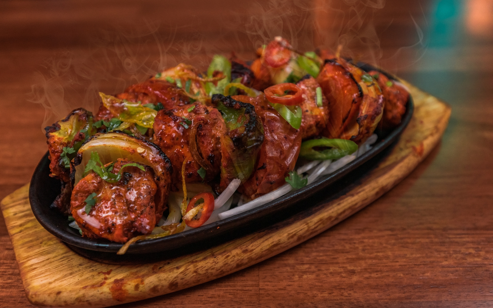 A warm and festive Tandoori Mix Grill platter for Christmas in Birmingham, featuring Chicken Tikka, 